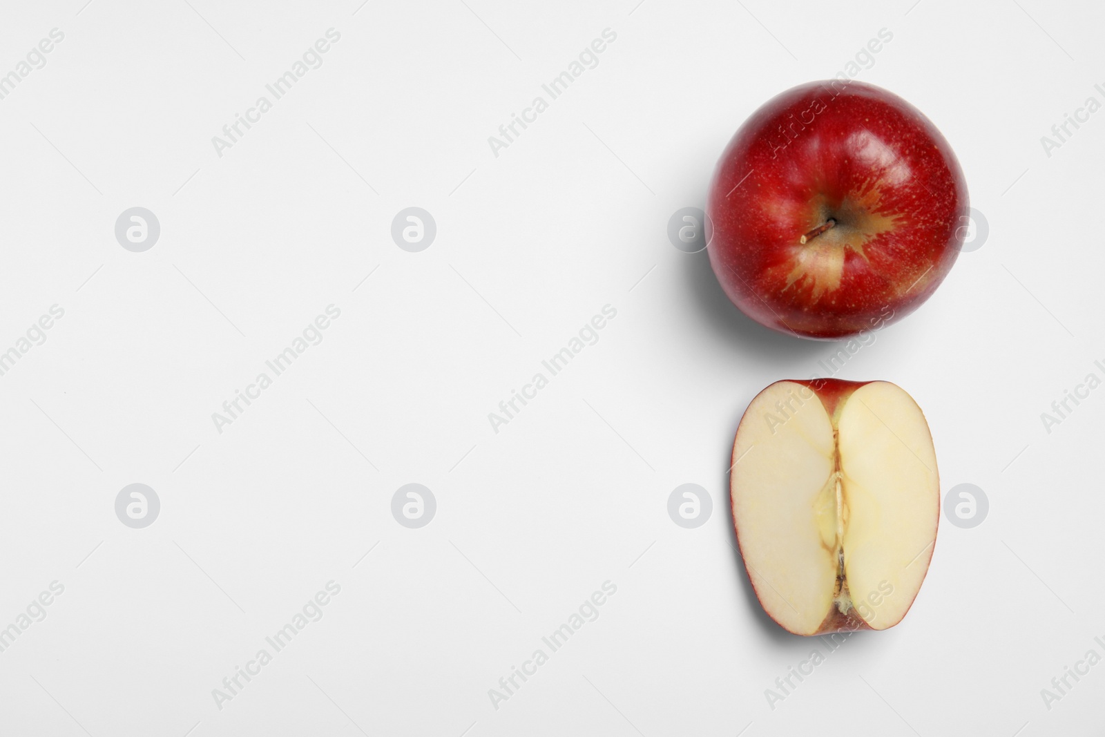 Photo of Ripe juicy red apples on white background, top view