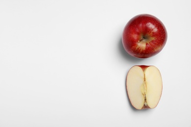 Photo of Ripe juicy red apples on white background, top view