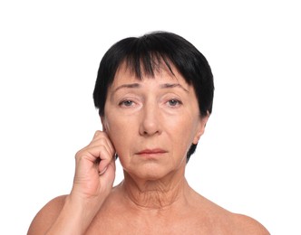 Photo of Senior woman suffering from ear pain on white background