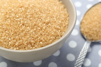 Photo of Brown sugar in bowl on table, closeup