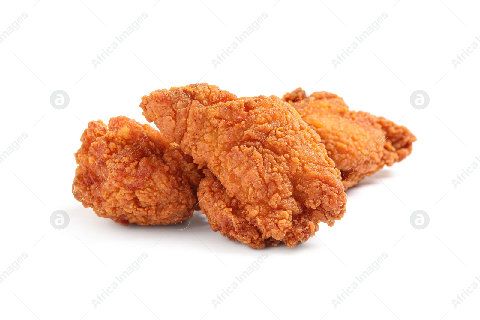 Photo of Tasty deep fried chicken pieces isolated on white