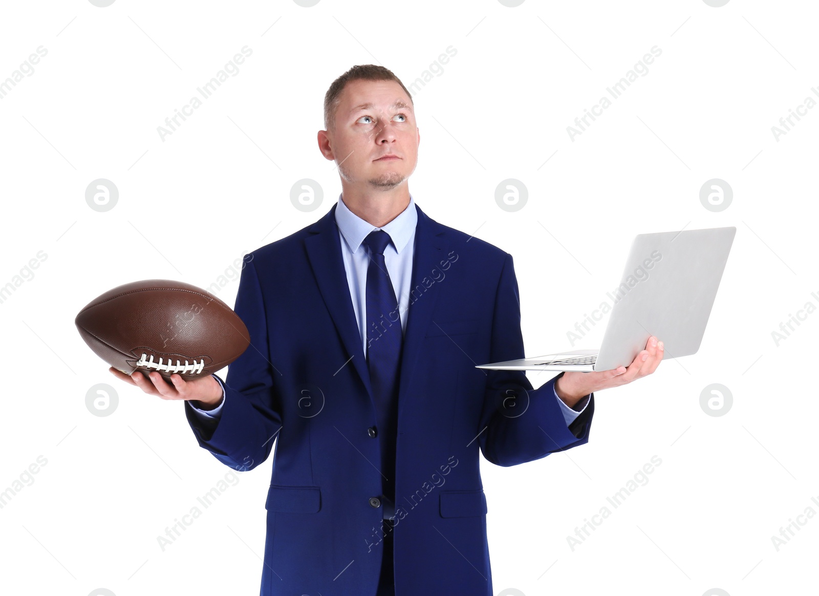 Photo of Portrait of businessman with ball and laptop on white background. Combining life and work