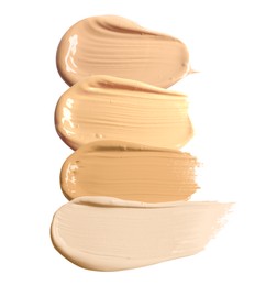 Image of Foundation of various shades for different skin tones isolated on white, top view. Set of samples