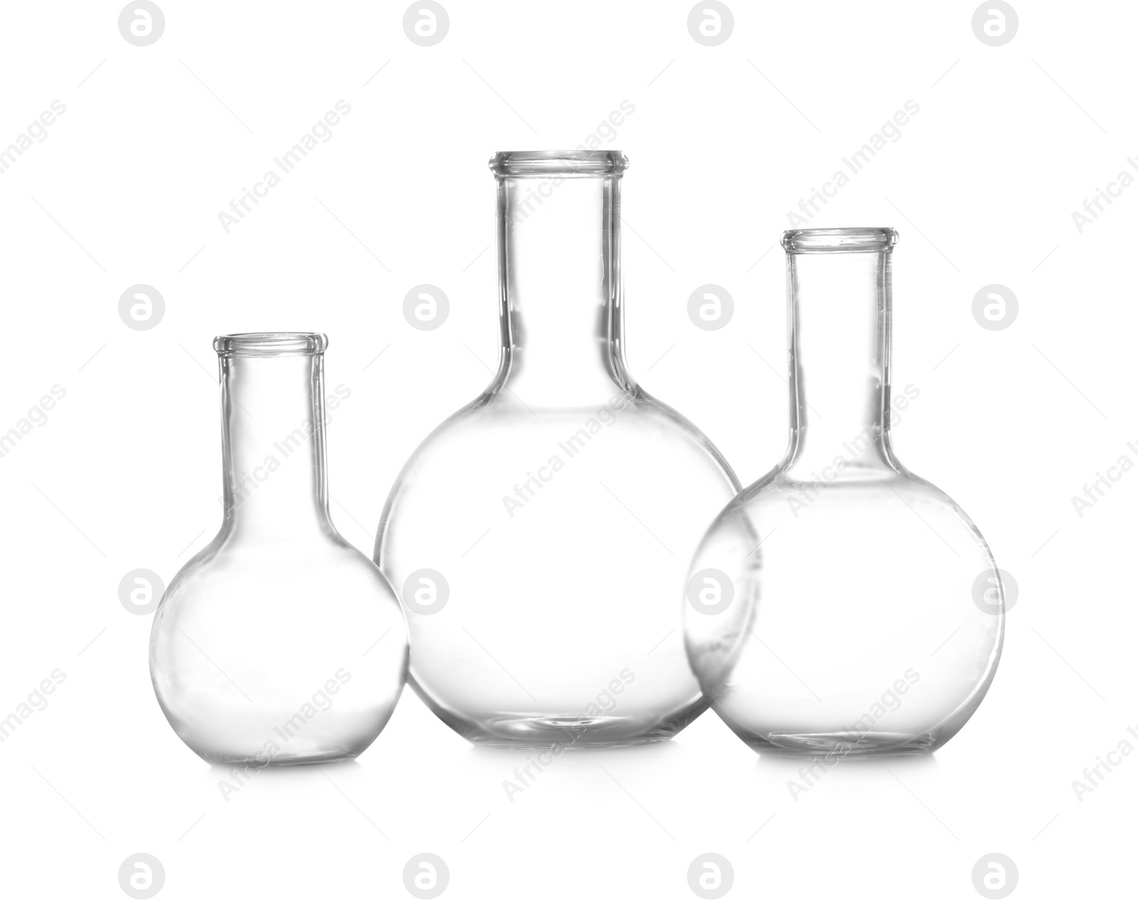 Photo of Empty Florence flasks on white background. Chemistry glassware