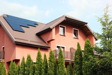 View of house with solar panels on roof