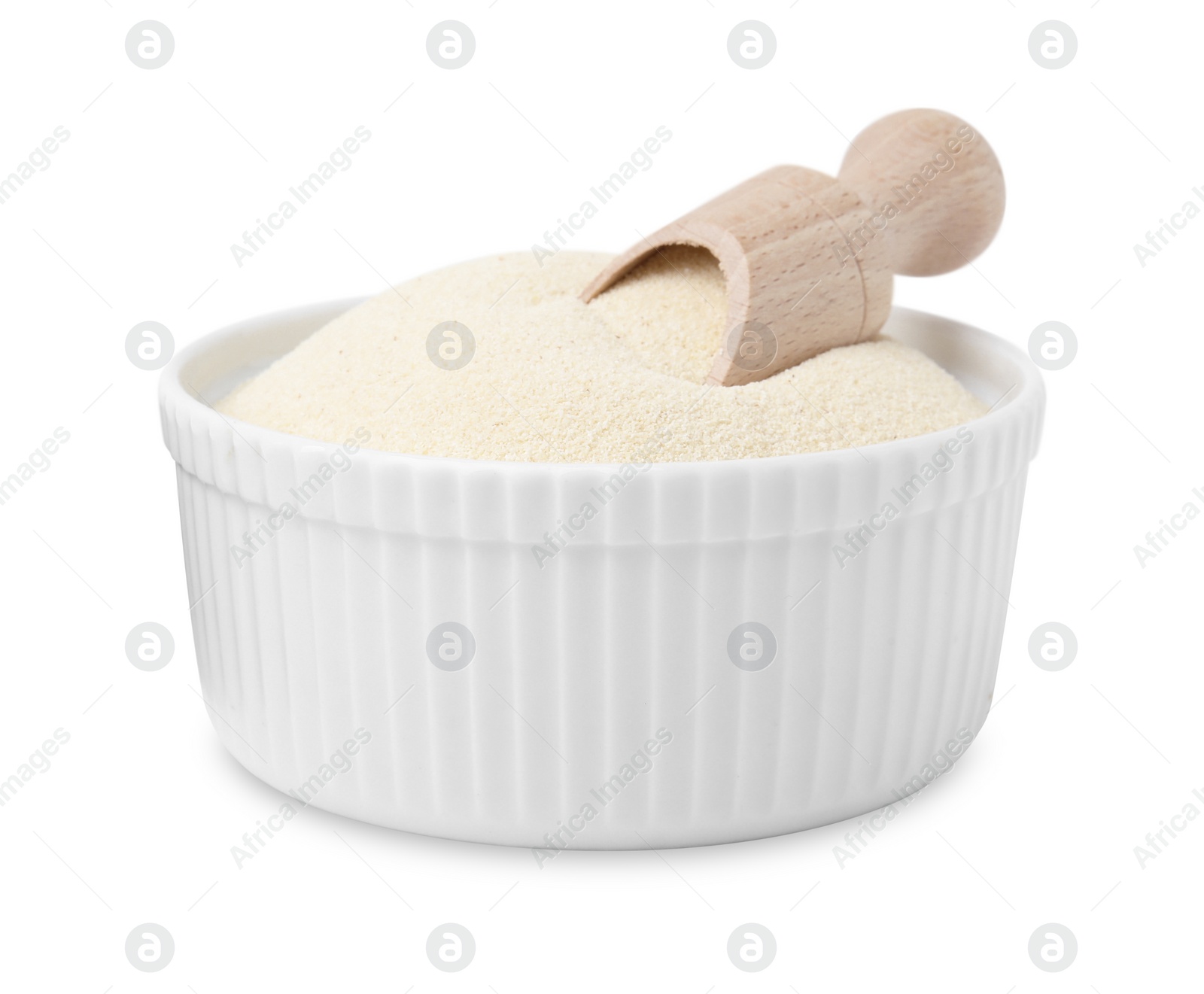 Photo of Bowl of uncooked organic semolina with wooden scoop isolated on white