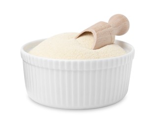 Photo of Bowl of uncooked organic semolina with wooden scoop isolated on white