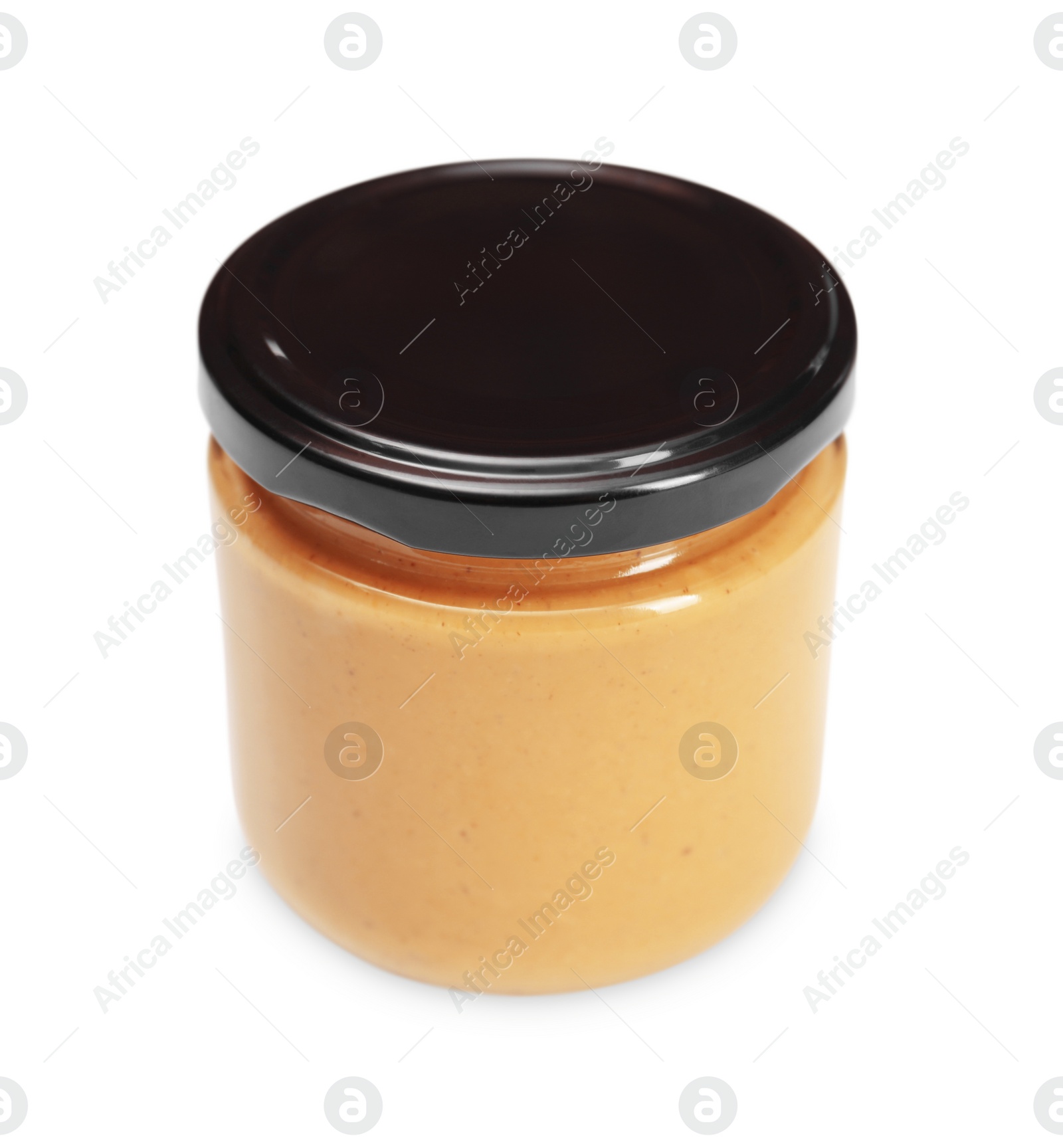 Photo of Tasty nut paste in jar isolated on white