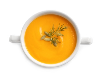 Delicious pumpkin cream soup in bowl on white background, top view