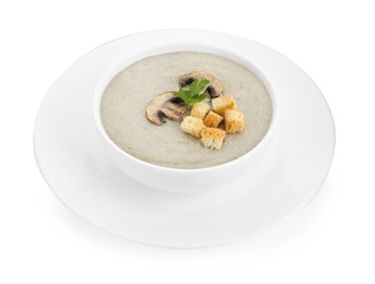 Photo of Delicious mushroom cream soup with croutons in bowl isolated on white
