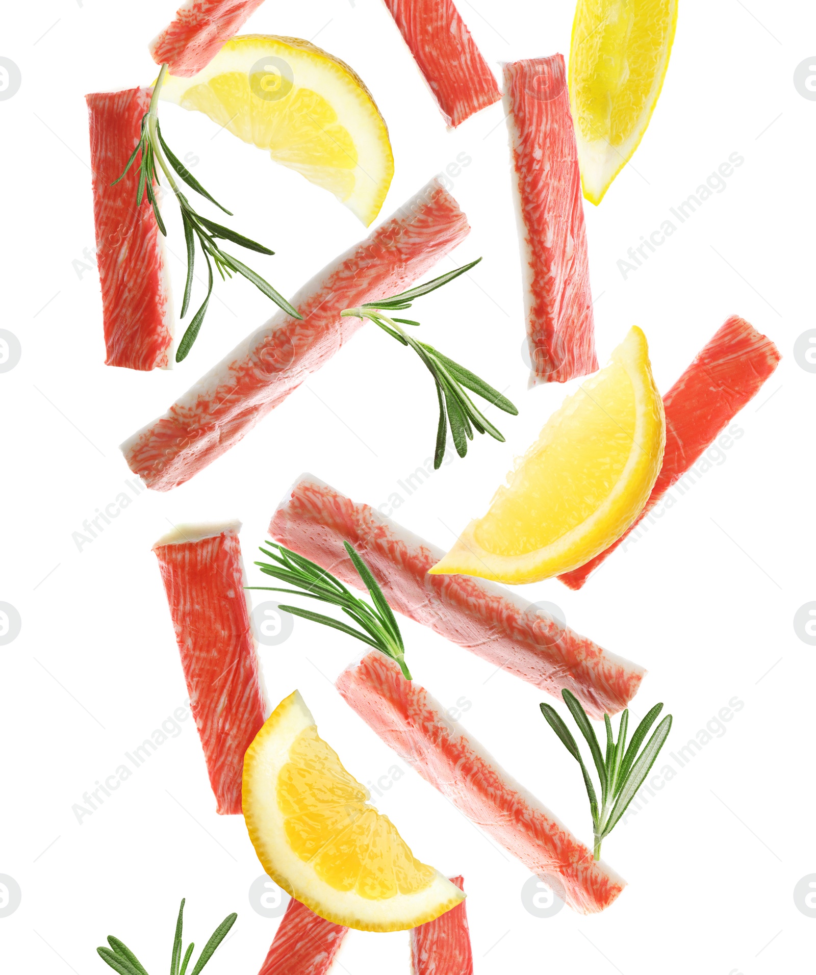 Image of Cut fresh crab sticks, lemon and rosemary falling on white background