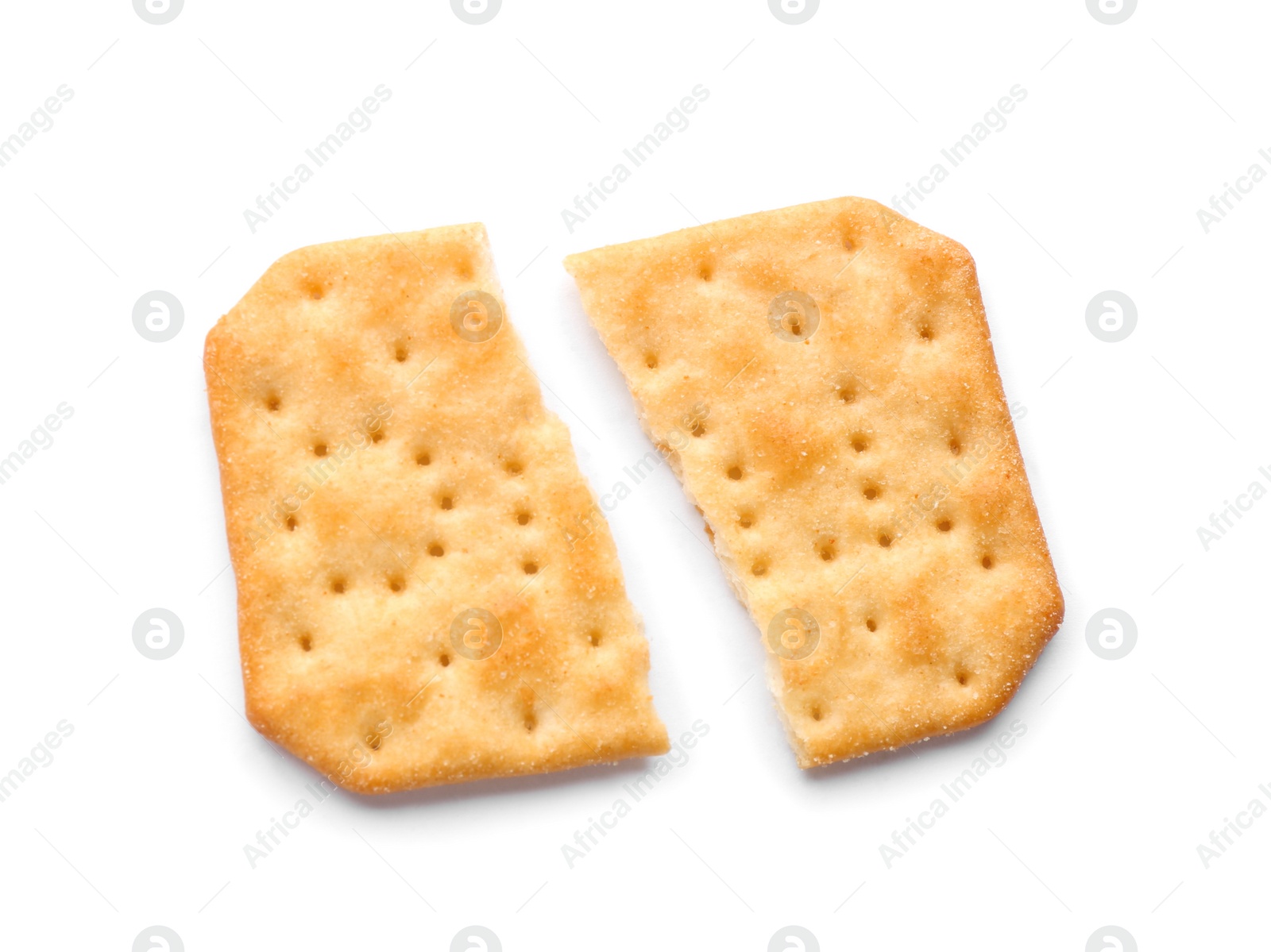 Photo of Broken delicious crispy cracker isolated on white, top view