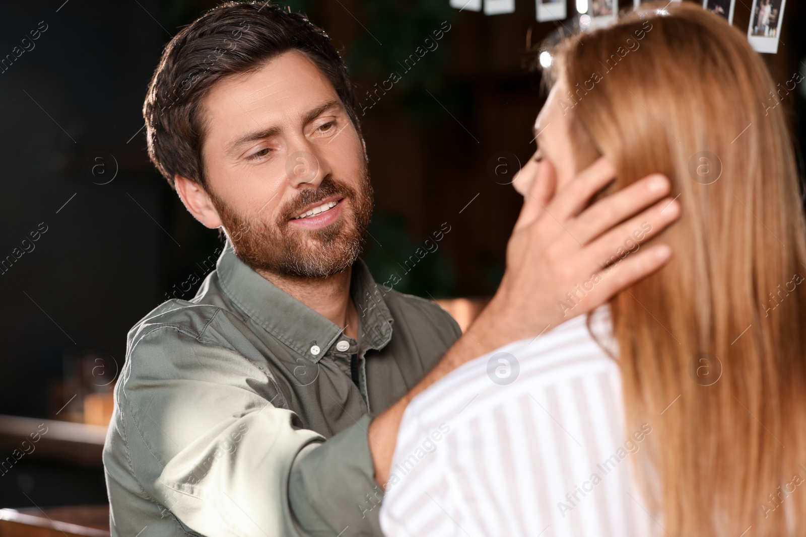 Photo of Romantic date. Lovely couple spending time together indoors