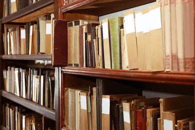 Image of Collection of different books on shelves in library