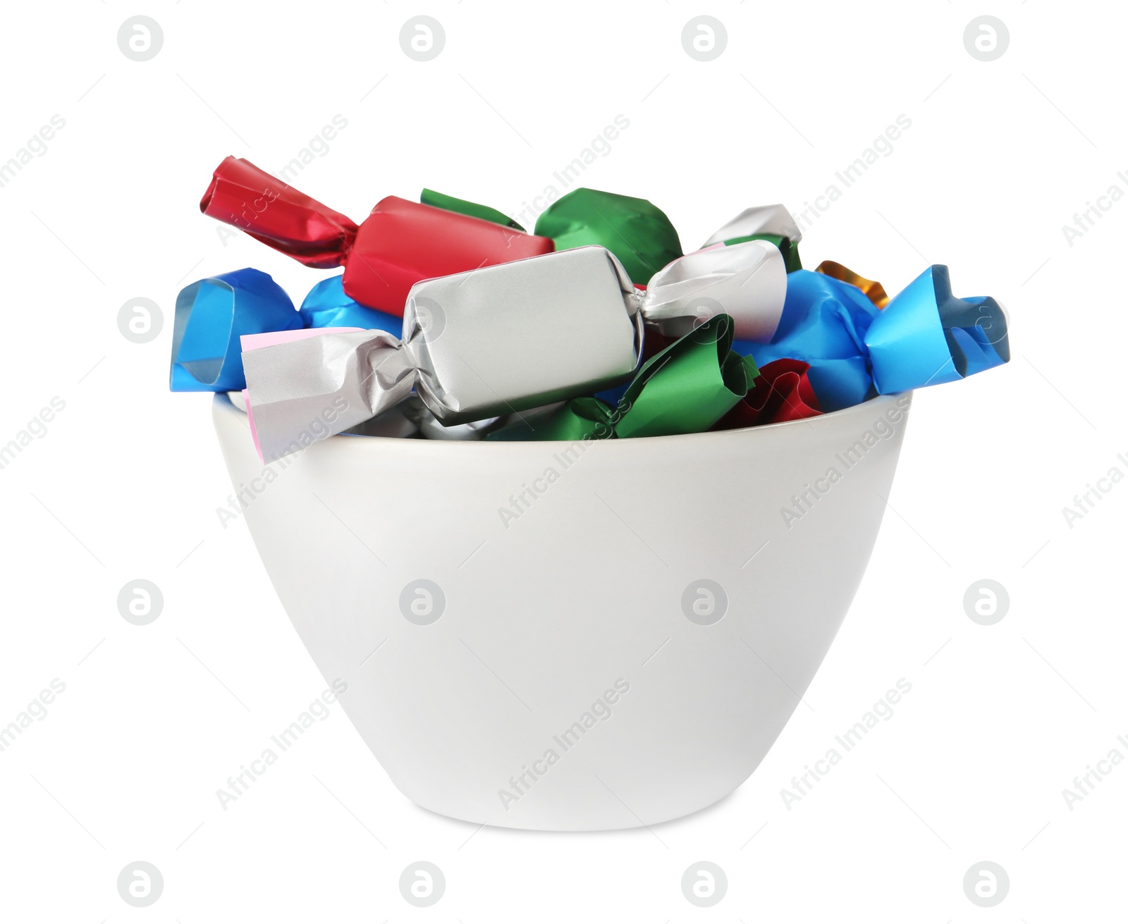 Photo of Bowl with candies in colorful wrappers isolated on white