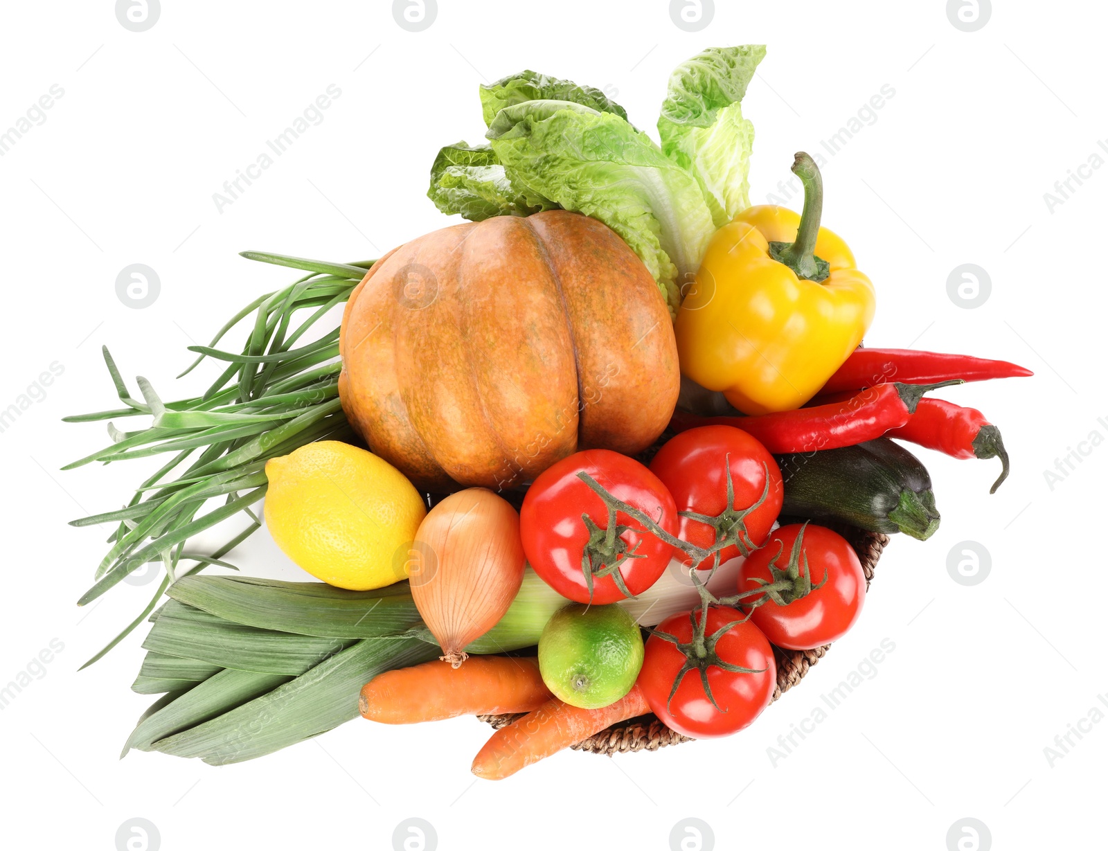 Photo of Fresh ripe vegetables and fruits in wicker bowl on white background, top view