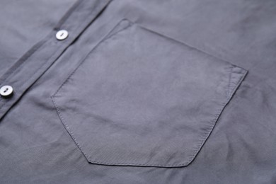 Photo of Gray shirt with pocket as background, closeup