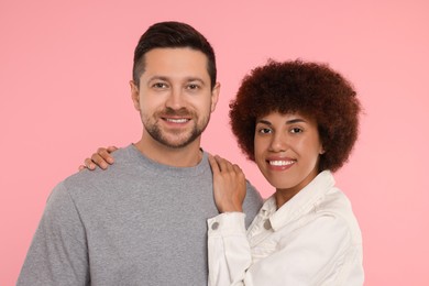 Photo of International dating. Portrait of lovely couple on pink background