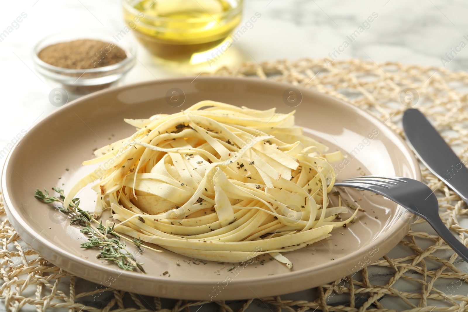 Photo of Fresh white carrot salad served on table, closeup