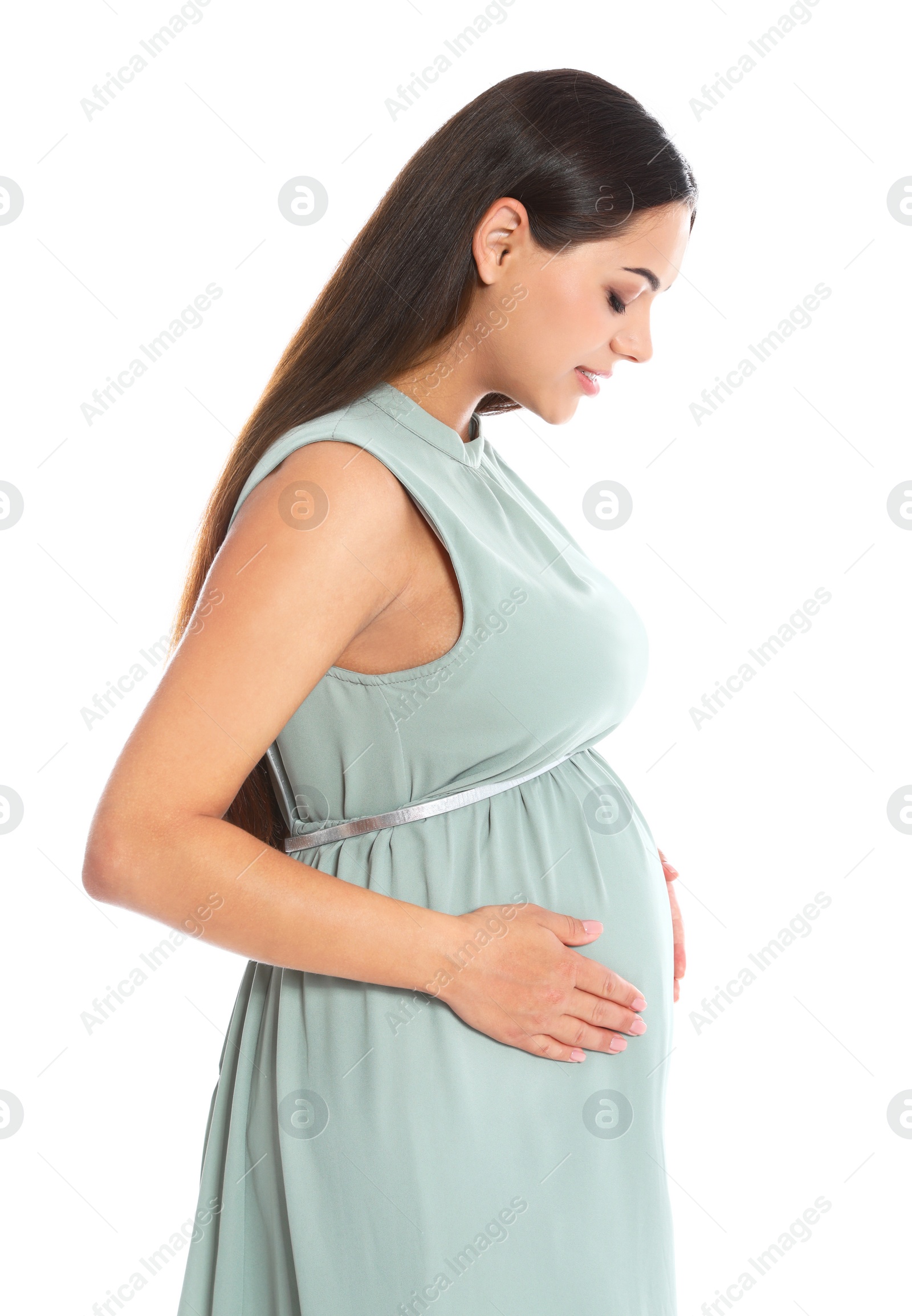 Photo of Portrait of beautiful young pregnant woman in dress on white background