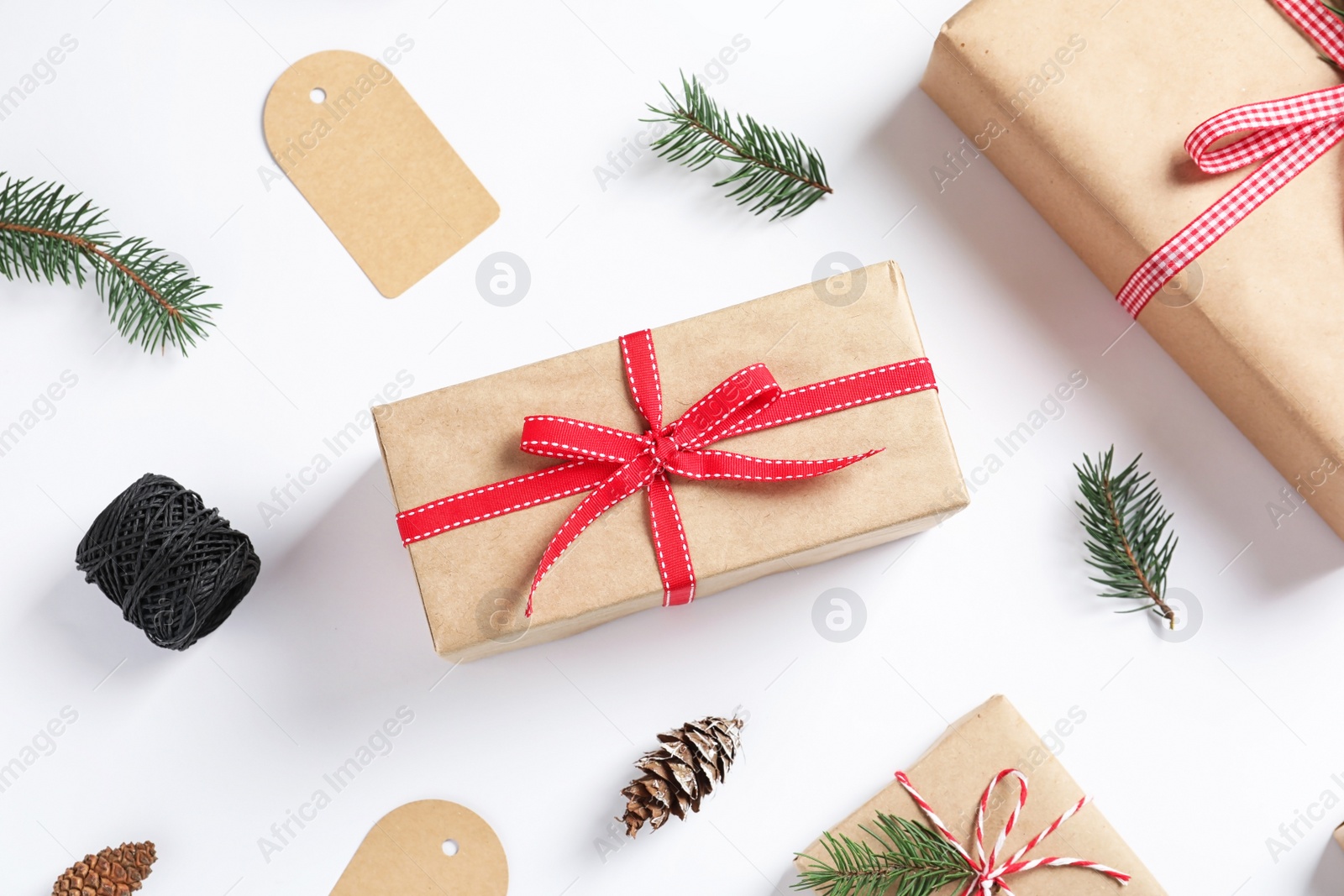 Photo of Flat lay composition with gift boxes on white background