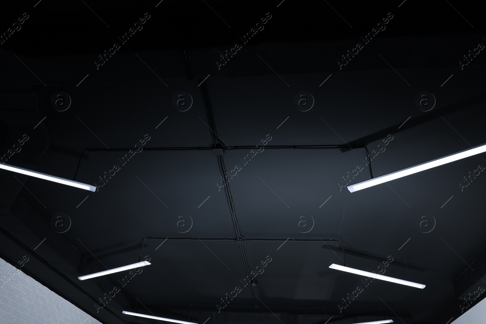 Photo of Ceiling with modern lights in renovated room