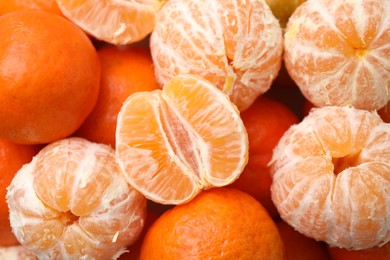 Many fresh ripe tangerines as background, top view