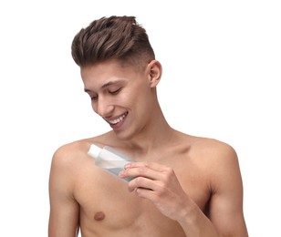Photo of Handsome man applying lotion onto his body on white background
