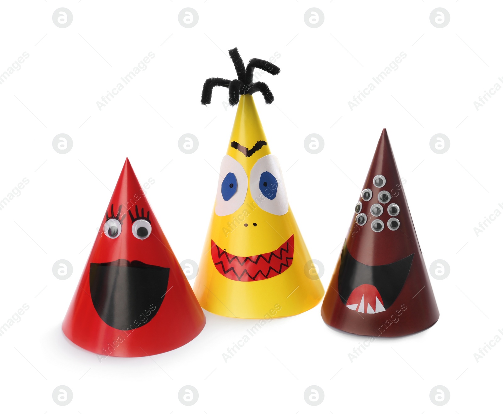 Photo of Funny monsters on white background. Halloween decoration