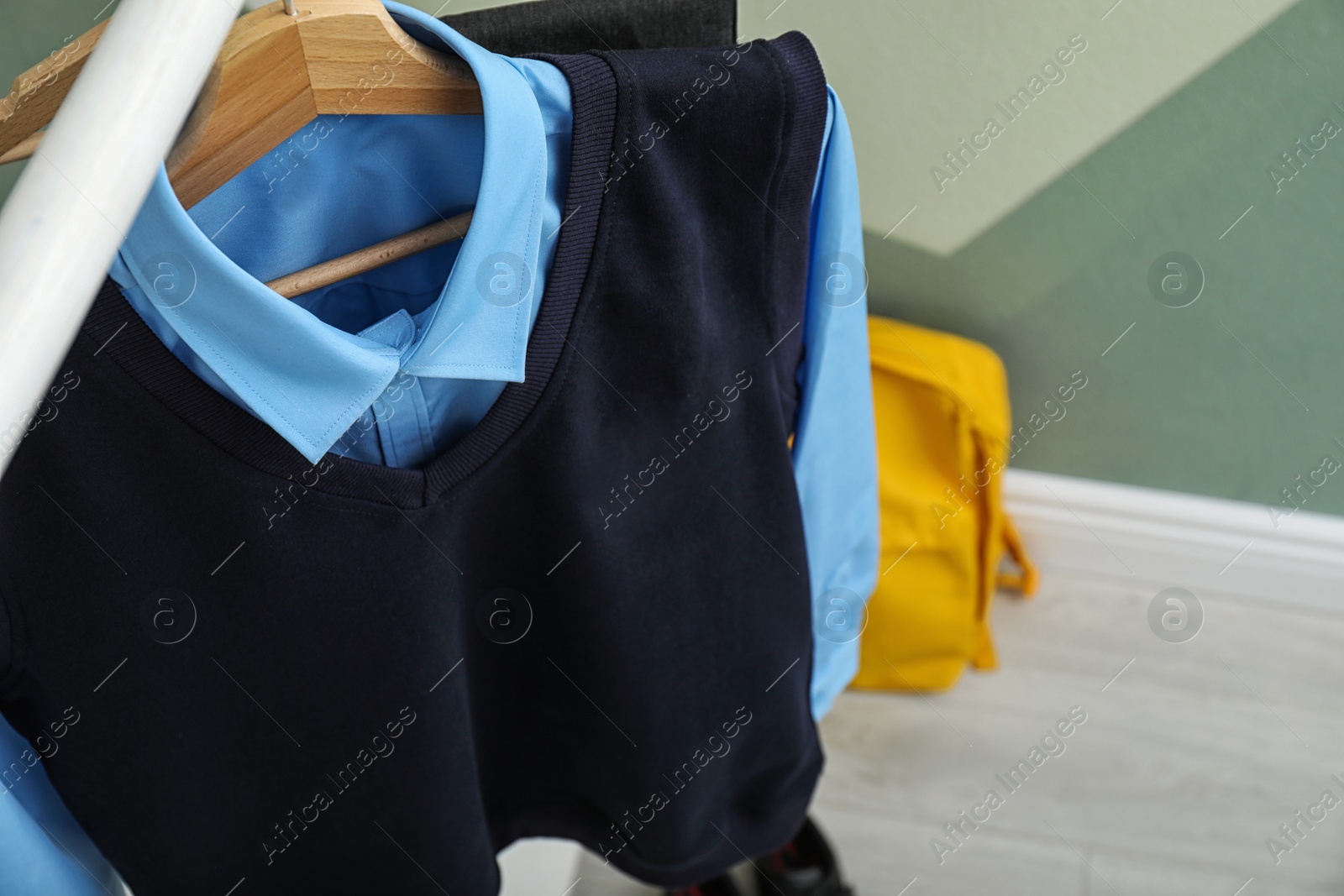 Photo of School uniform for boy on rack indoors