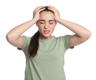 Photo of Young woman suffering from headache on white background