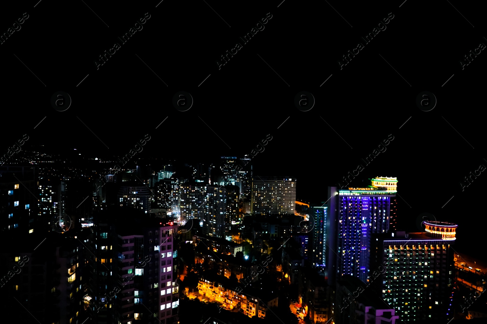 Photo of Picturesque view of city with buildings at night