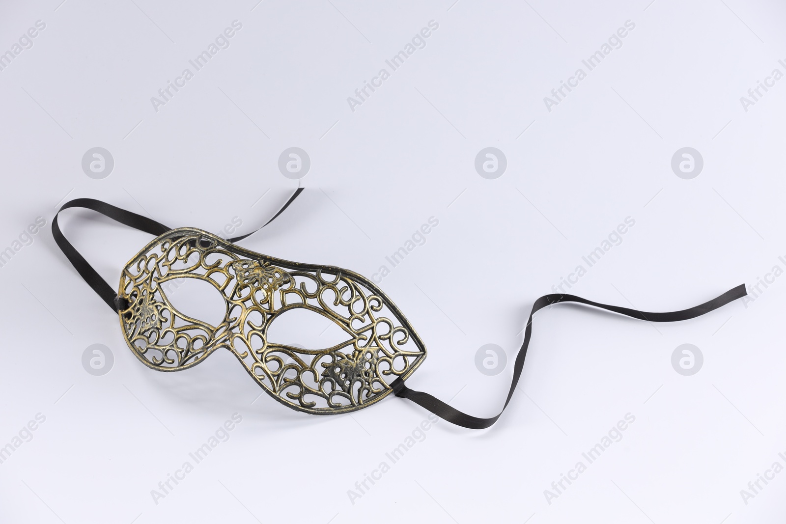 Photo of Elegant face mask on white background. Theatrical performance