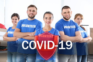 Image of Volunteers uniting to help during COVID-19 outbreak. Group of people and shield illustration