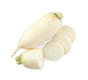 Sliced and whole fresh ripe turnips on white background, top view