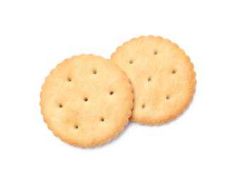 Photo of Two crispy crackers isolated on white, top view. Delicious snack