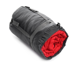 Photo of Sleeping bag in case on white background. Camping equipment