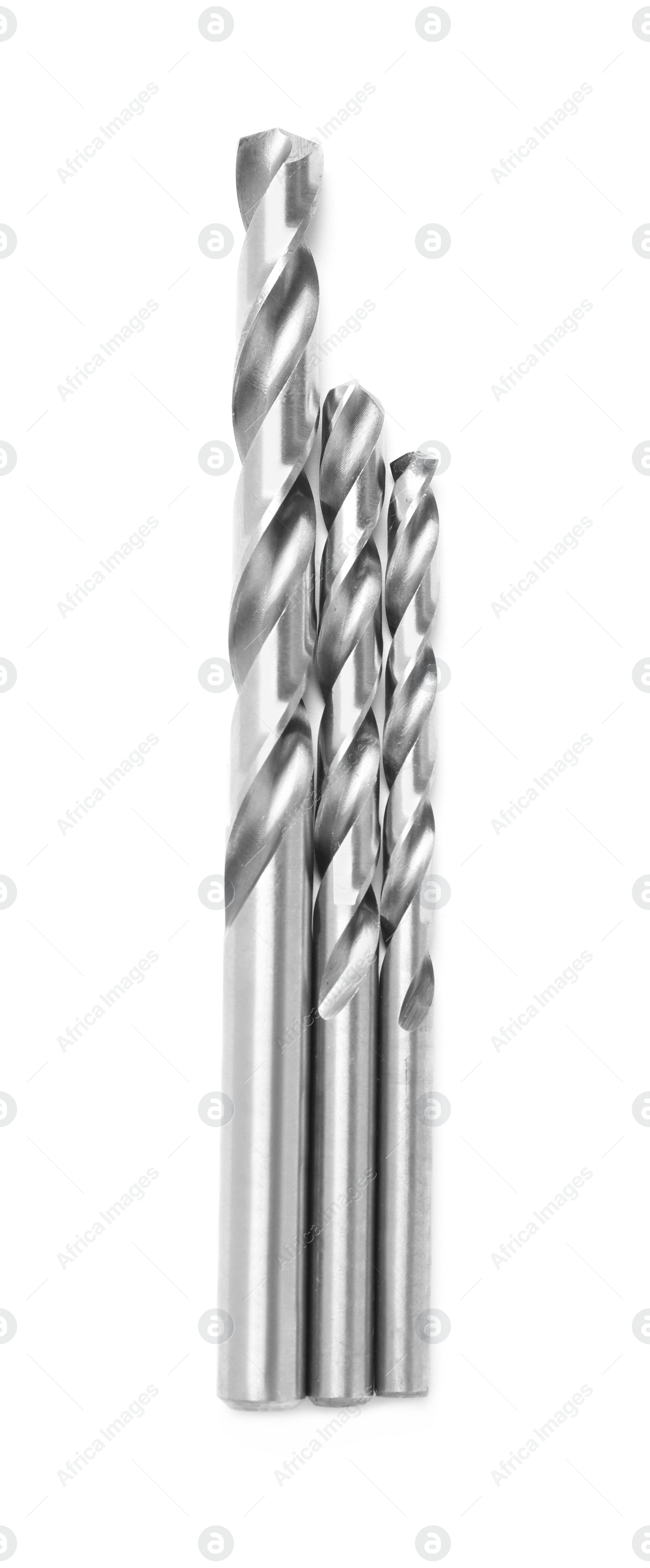 Photo of Many twist drill bits isolated on white, top view. Carpenter's tools