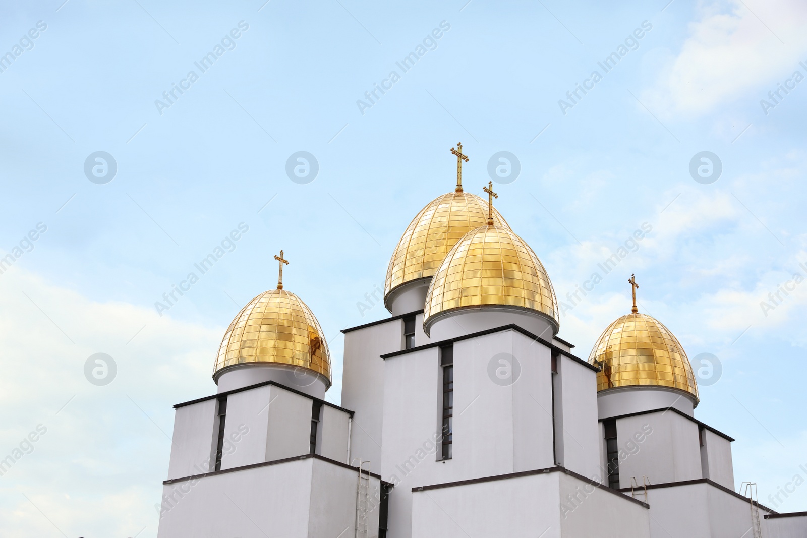 Photo of Beautiful church against blue sky, low angle view