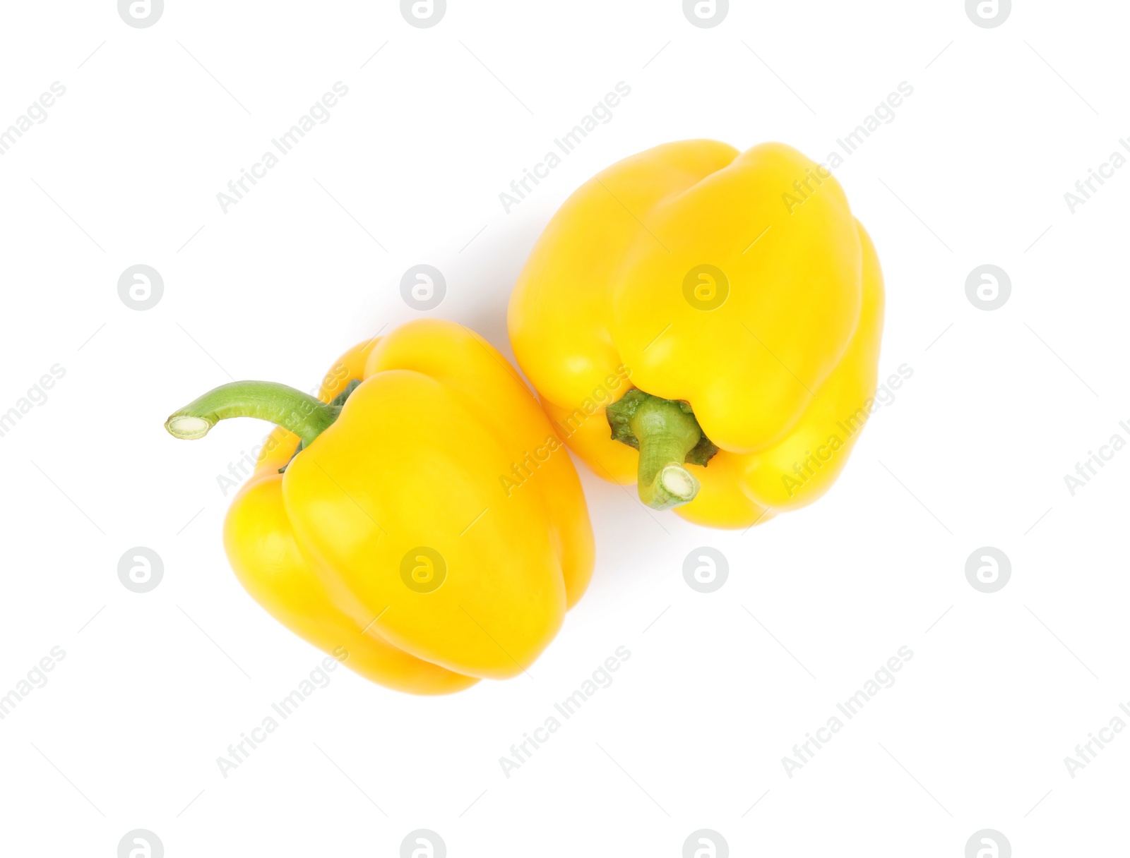 Photo of Ripe yellow bell peppers isolated on white, top view