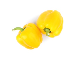 Ripe yellow bell peppers isolated on white, top view