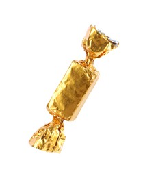 Photo of Tasty candy in golden wrapper isolated on white