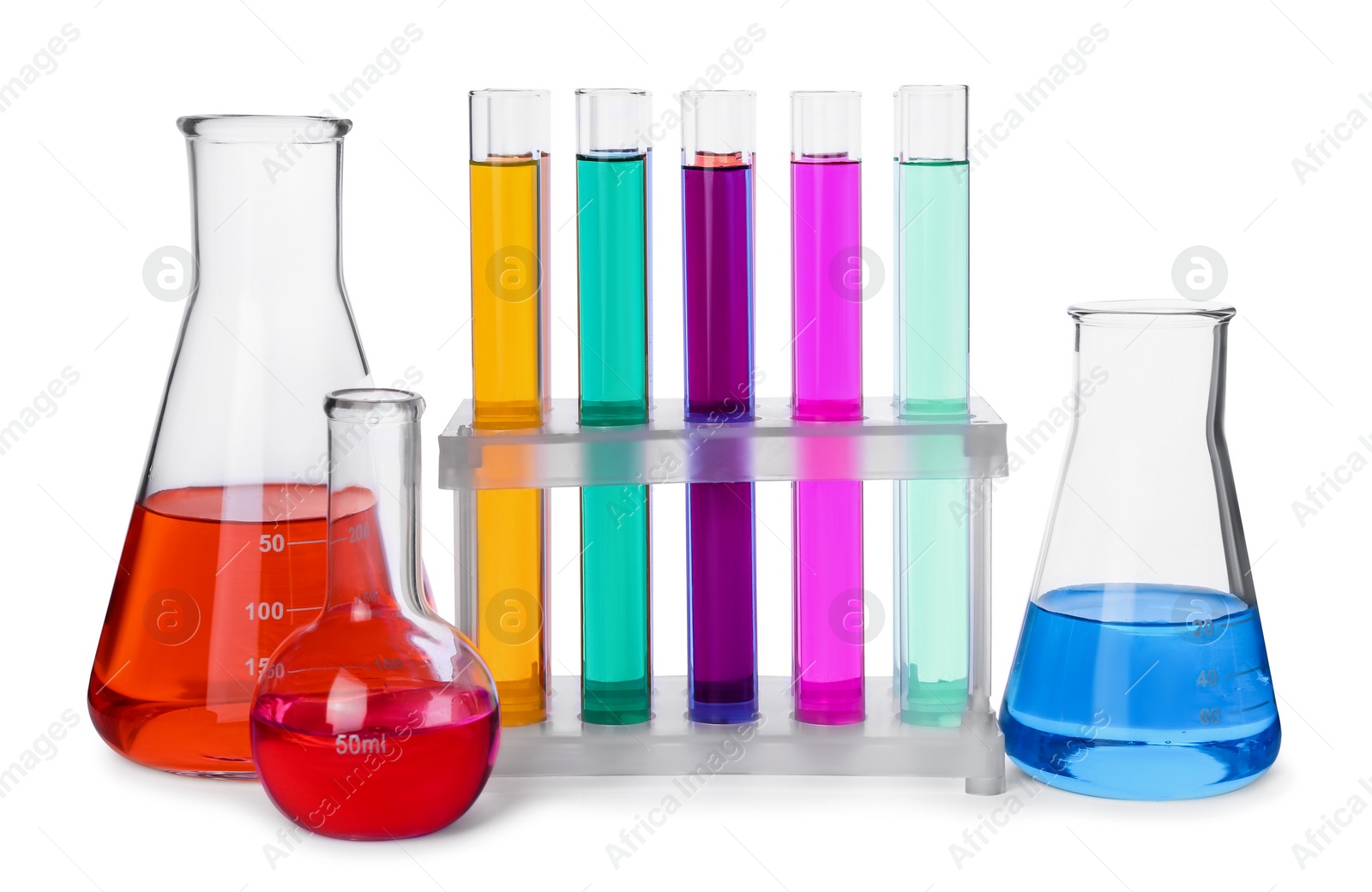 Photo of Test tubes and other laboratory glassware with colorful liquids on white background