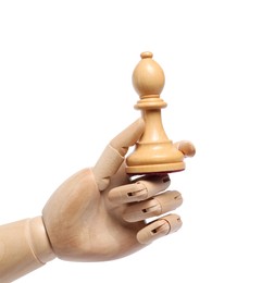 Photo of Robot with chess piece isolated on white. Wooden hand representing artificial intelligence