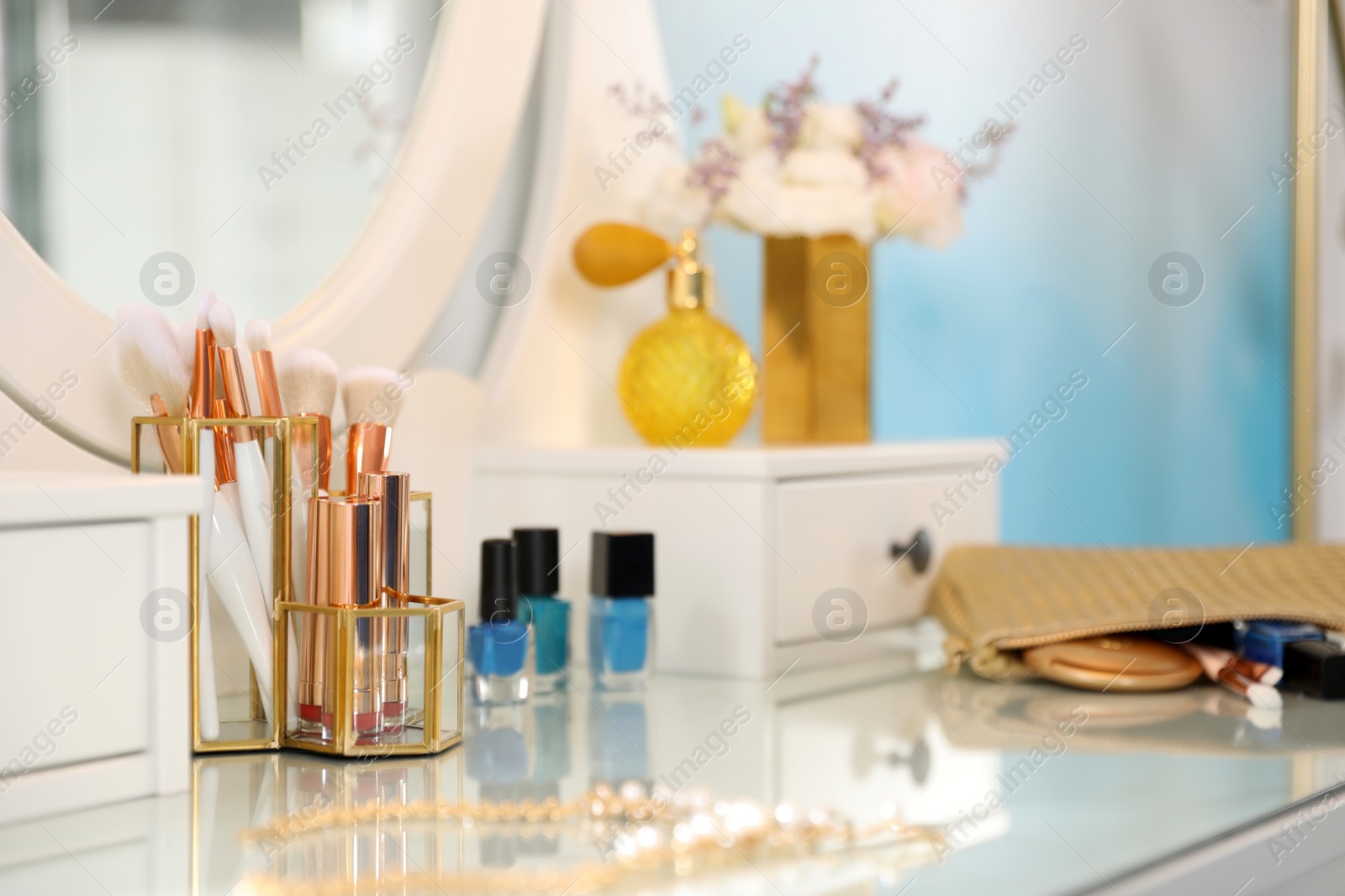 Photo of Elegant dressing table with accessories in stylish room interior