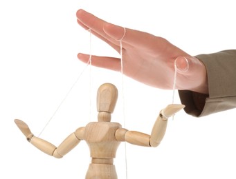 Woman pulling strings of puppet on white background, closeup