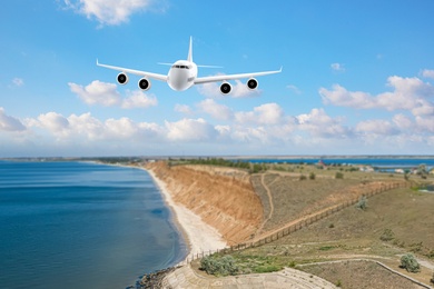 Image of Modern airplane flying in sky over sea