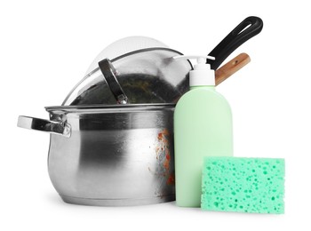 Photo of Stack of dirty kitchenware, dish detergent and sponge on white background