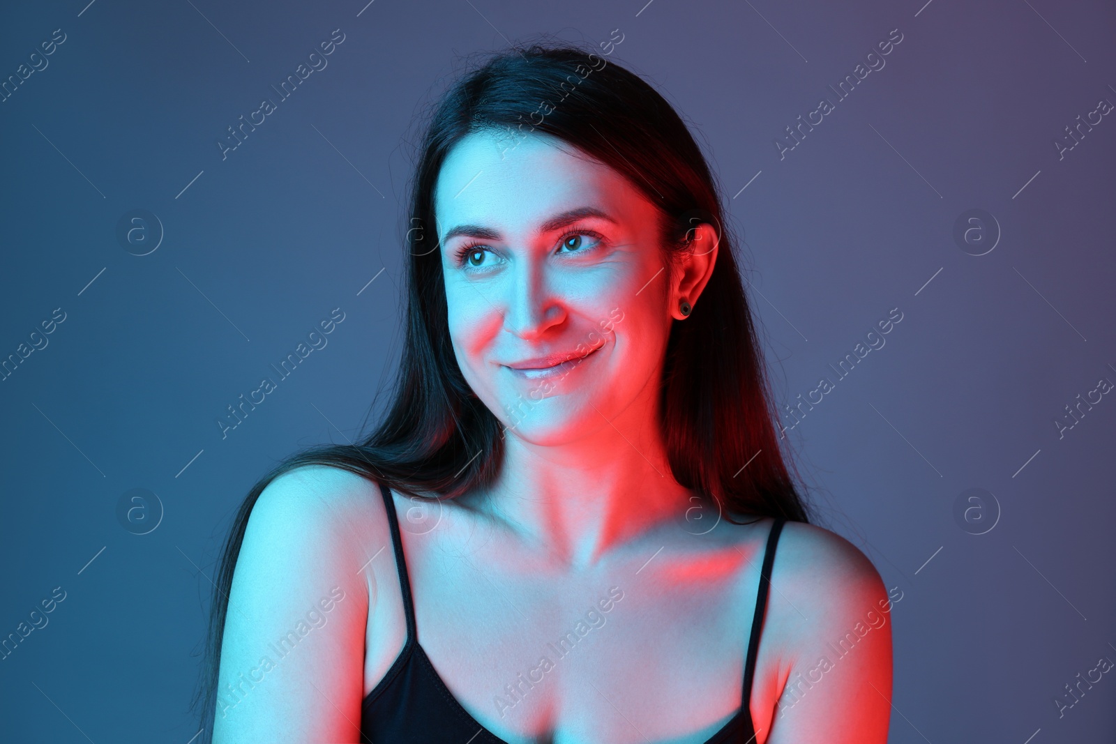 Photo of Portrait of beautiful young woman on color background
