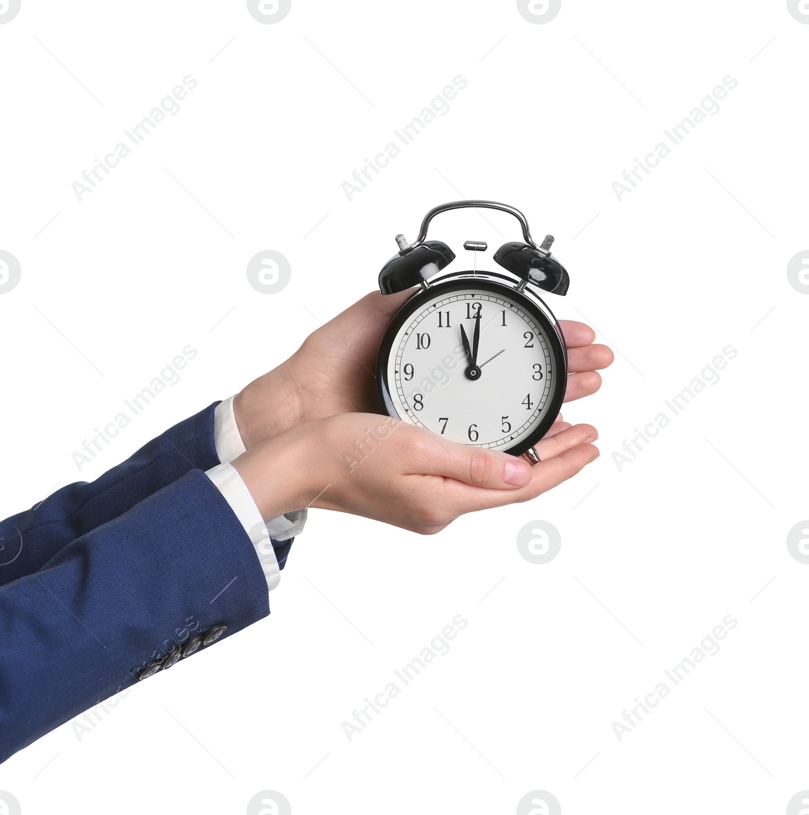 Photo of Businesswoman holding alarm clock on white background. Time concept